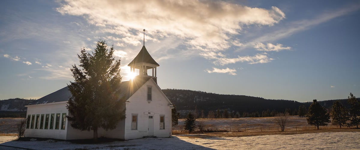 Sun setting on an old church